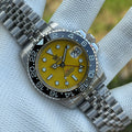 Steeldive SD1993 GMT dive watch with yellow dial and black ceramic bezel, jubilee bracelet front view