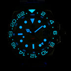Steeldive SD1993 GMT watch lume shot with bright blue luminous indices and bezel numerals in the dark