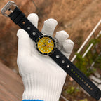 Steeldive SD1994 watch with yellow dial on full length black rubber dive strap, flat lay
