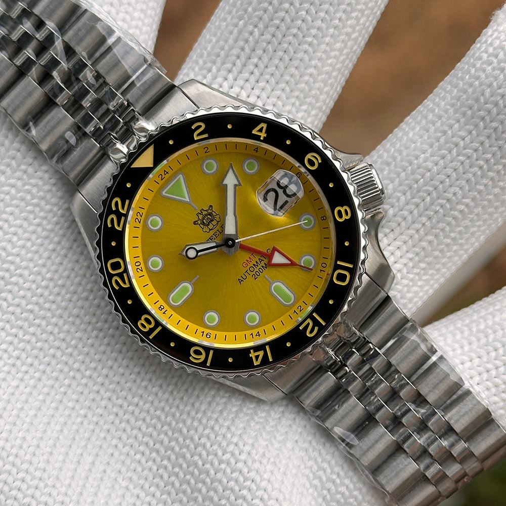 Steeldive SD1994 yellow dial GMT on jubilee bracelet shown at angled studio view