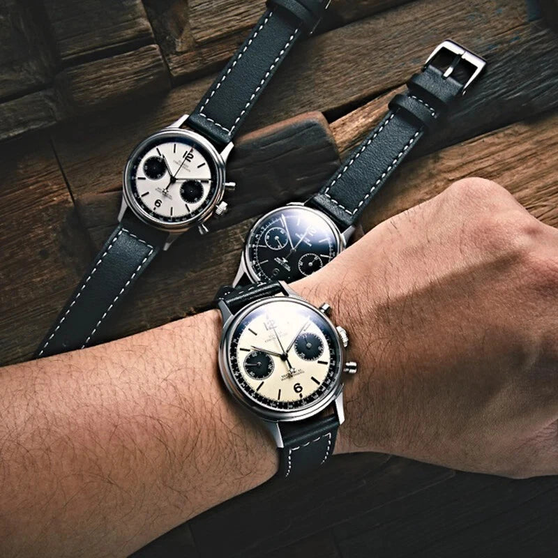 Sugess 1963 V3 men's chronograph panda watch comparison showing three dial variants on wood surface
