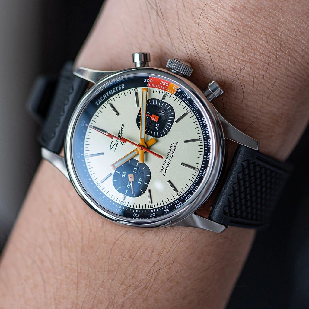 Sugess 387F cream panda chronograph worn on wrist with black rubber strap, close-up