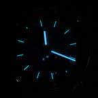 Sugess 387F chronograph dial glowing blue lume in the dark, hour markers and hands, close-up