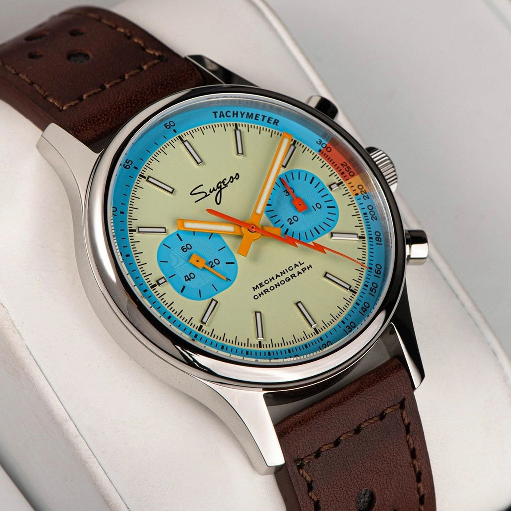 Sugess 387F teal-blue panda chronograph on brown racing leather strap, dramatic angled view
