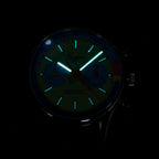 Sugess 387F teal-blue panda chronograph dial glowing green lume in the dark, close-up