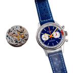 Sugess S387 dark blue chronograph beside its ST1901 hand-wound movement, flat-lay on wood