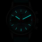 Sugess S387 chronograph dial glowing blue-green lume in the dark, hour markers and hands, close-up