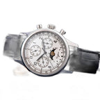 Sugess S389-2-01 moonphase chronograph on black leather strap, angled on blue surface, three-quarter view