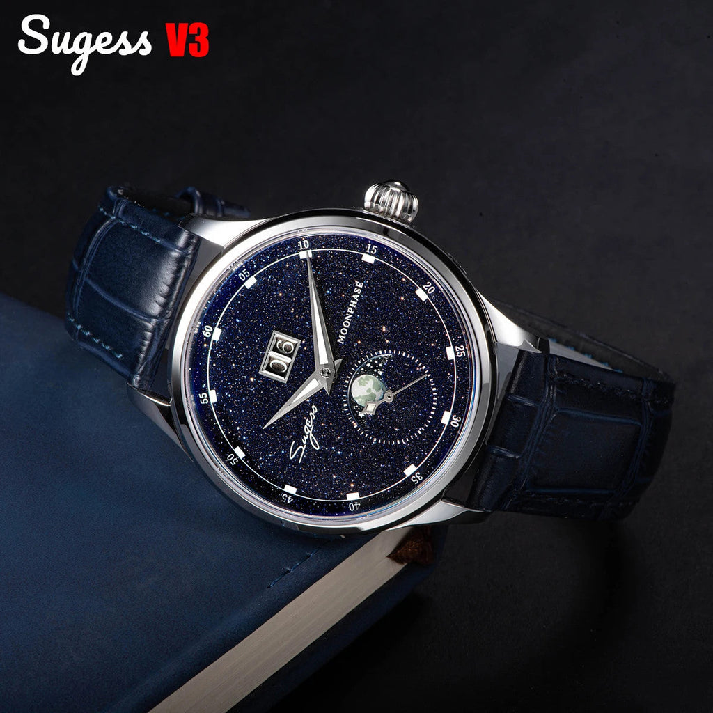 Sugess S401B moonphase watch with blue sandstone dial and blue leather strap displayed on book