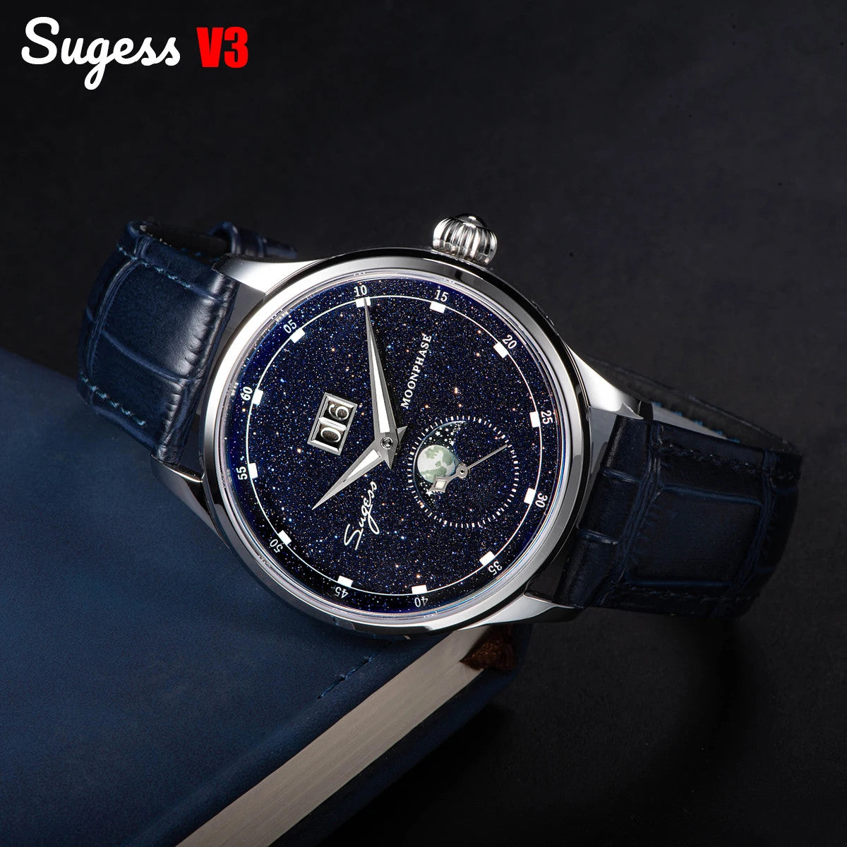 Sugess S401B moonphase watch with blue sandstone dial and blue leather strap displayed on book