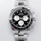 Sugess S418-2 black panda chronograph with black ceramic bezel on steel bracelet, front view on grey