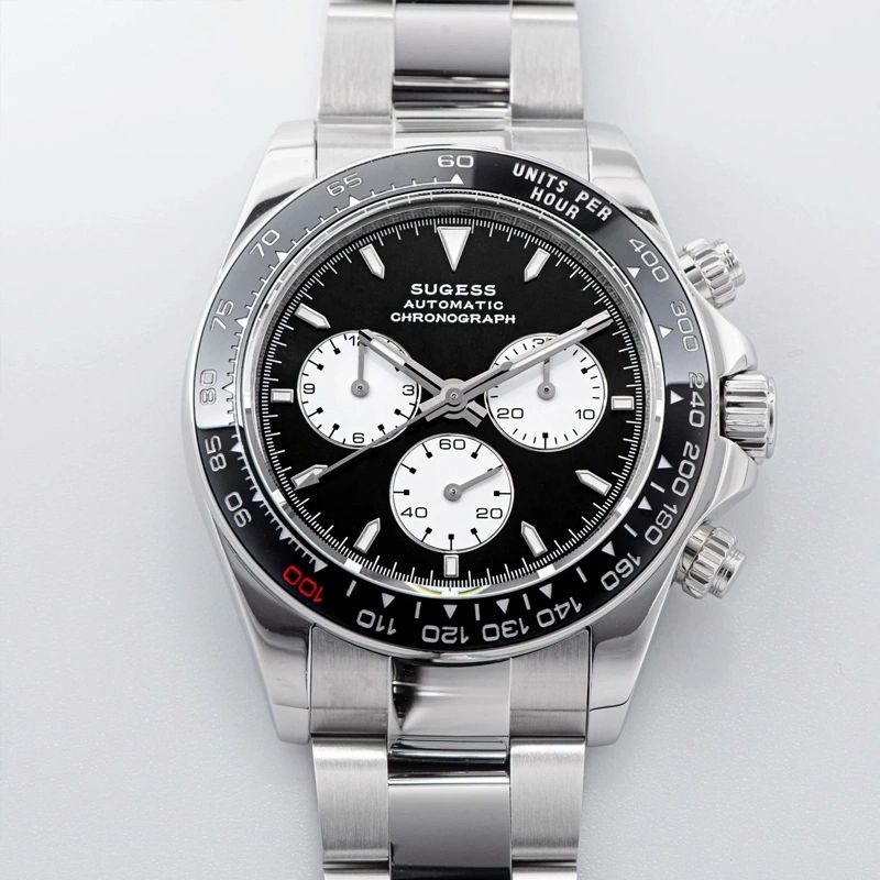 Sugess S418-2 black panda chronograph with black ceramic bezel on steel bracelet, front view on grey