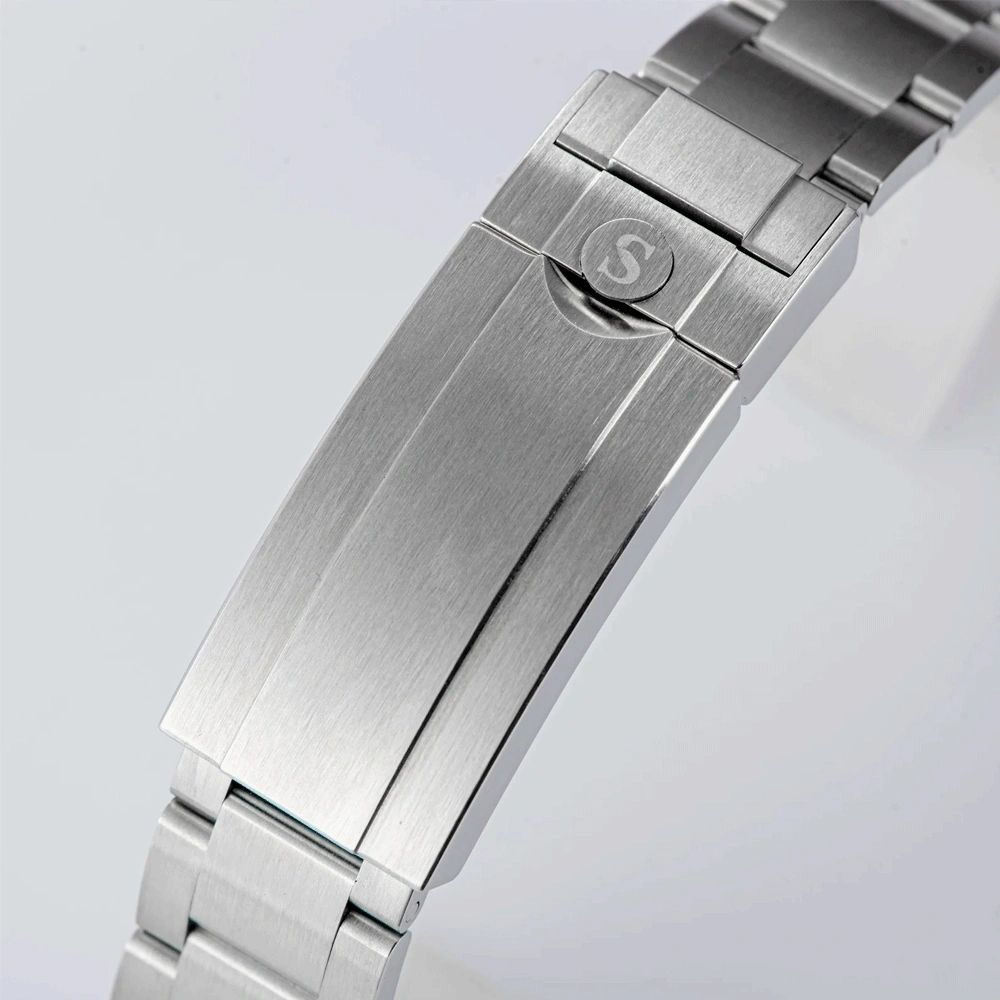 Sugess S418-2 steel folding clasp with S emblem, brushed finish, close-up