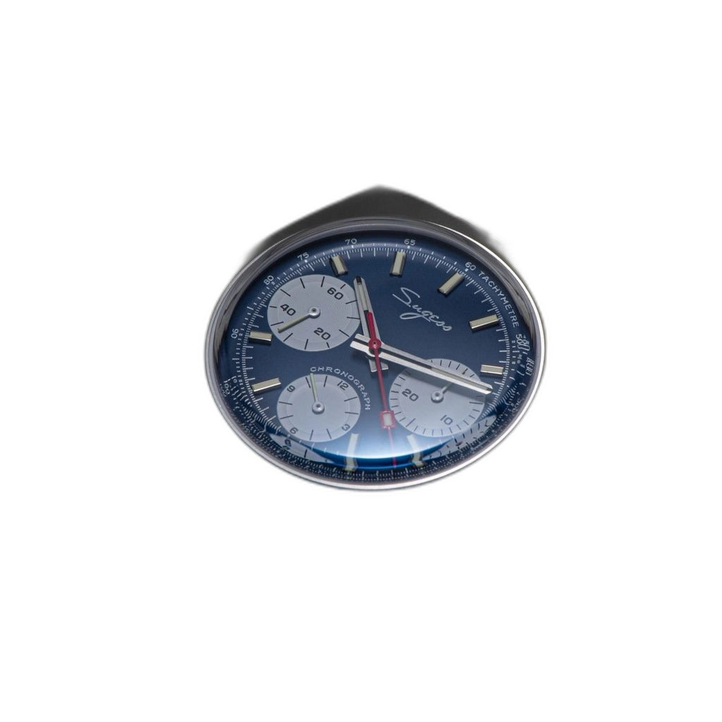 Sugess S419 blue dial with white sub-dials on steel bracelet, three-quarter angled view on blue tray