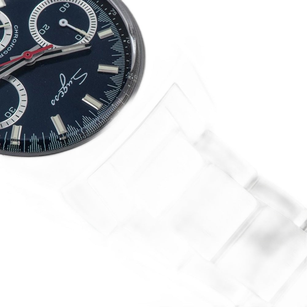 Sugess S419 blue dial with white sub-dials and red chrono hand, steel bracelet, macro close-up on dark