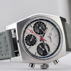 Sugess S419 white panda dial, black sub-dials, grey canvas strap, angled front-quarter view on white