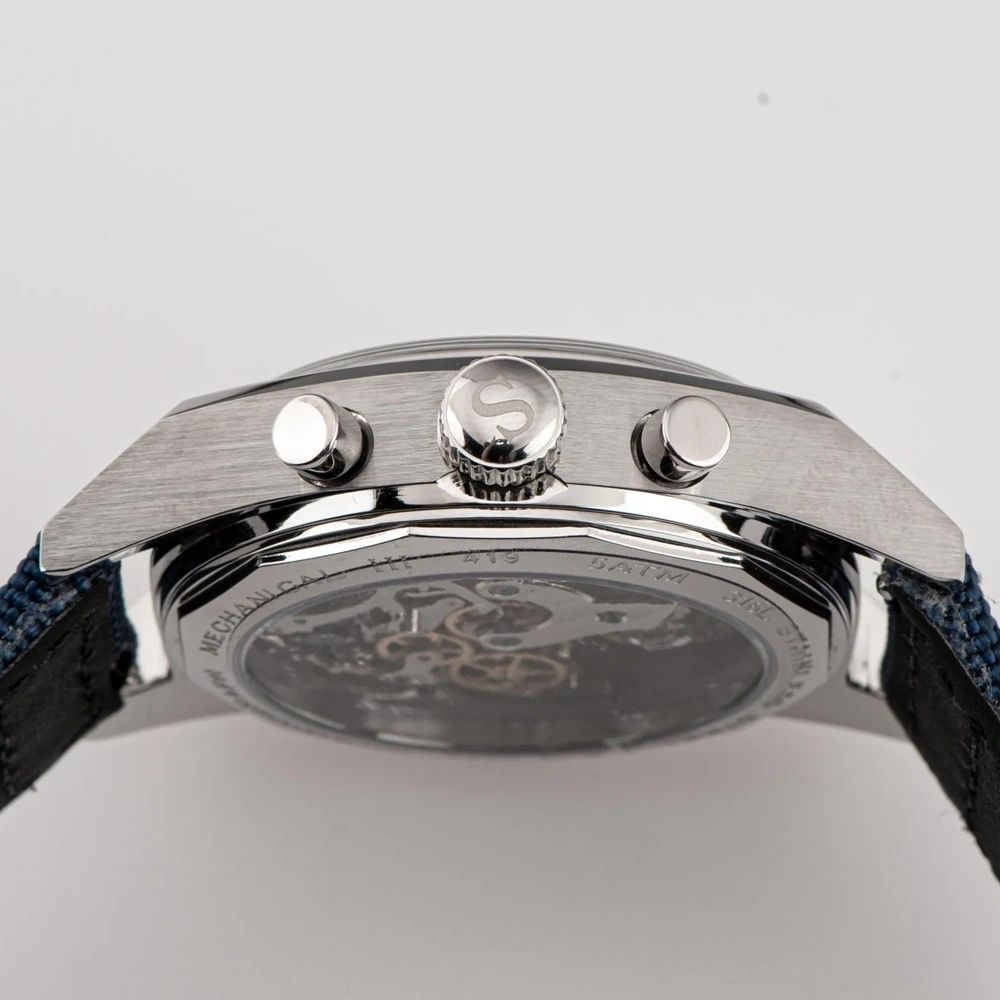 Sugess S419 white panda chronograph angled side profile, grey canvas strap, pushers and crown, close-up