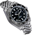 Sugess S420-2 GMT diver, black bezel, black dial with date cyclops, jubilee bracelet, angled close-up view