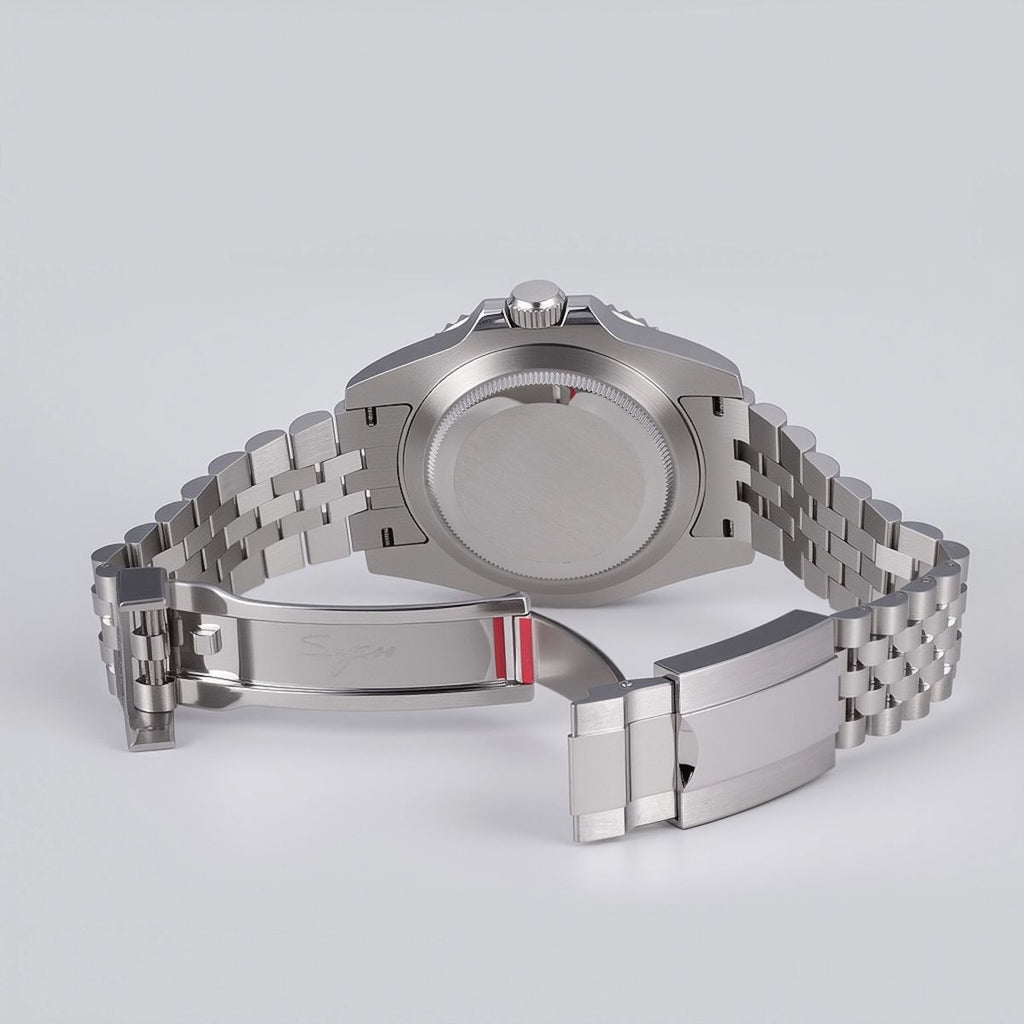 Sugess S420-2 brushed solid steel screw-down caseback and jubilee clasp, rear view on grey