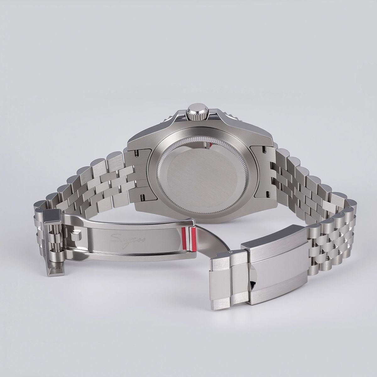 Sugess S420-2 brushed solid steel screw-down caseback and jubilee clasp, rear view on grey