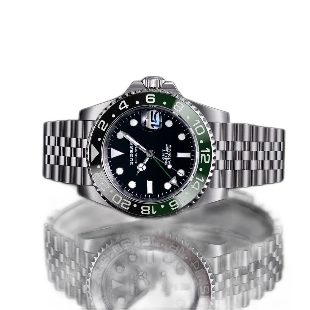 Sugess S420-2 Sprite GMT diver, green and black bezel, black dial, jubilee bracelet, front view reflected on black