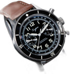 Sugess S423 black-dial chronograph, black bezel, brown leather strap, angled close-up view with crown