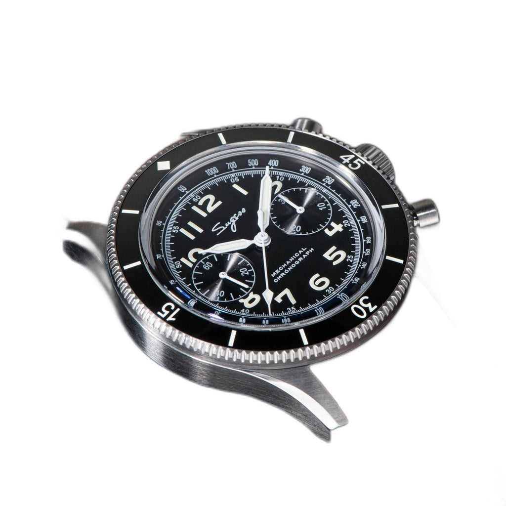 Sugess S423 black-dial chronograph, black bezel, brown leather strap, dramatic three-quarter angled view