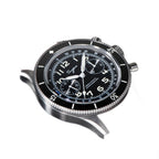 Sugess S423 black-dial chronograph, black bezel, brown leather strap, dramatic three-quarter angled view
