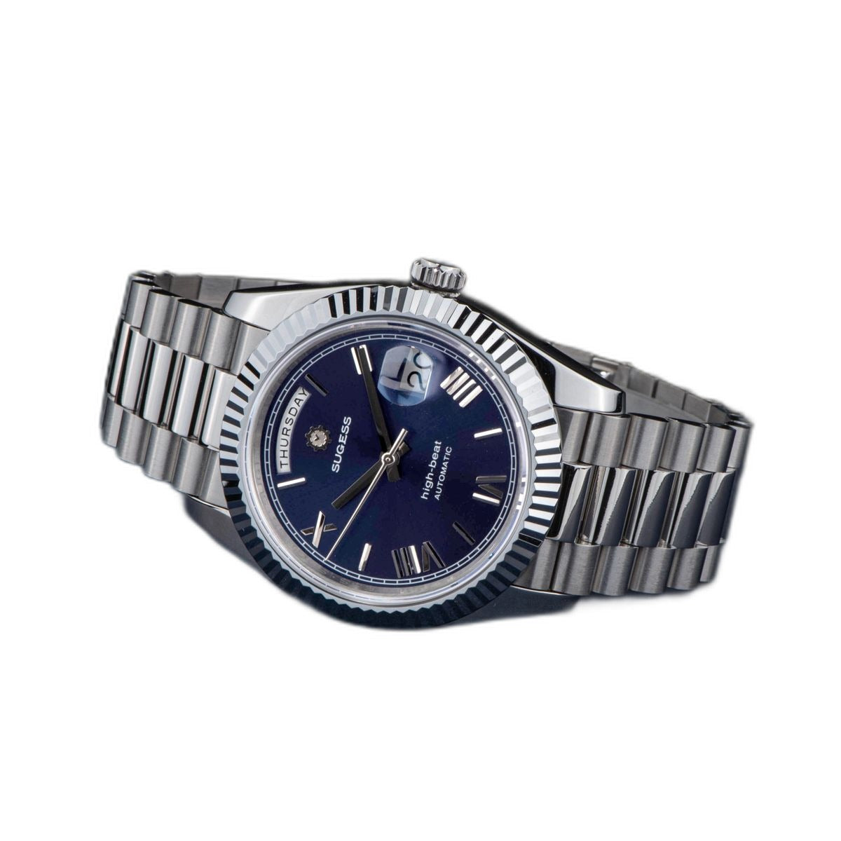 Sugess S433 blue dial day-date, fluted bezel, steel president bracelet, angled view beside camera