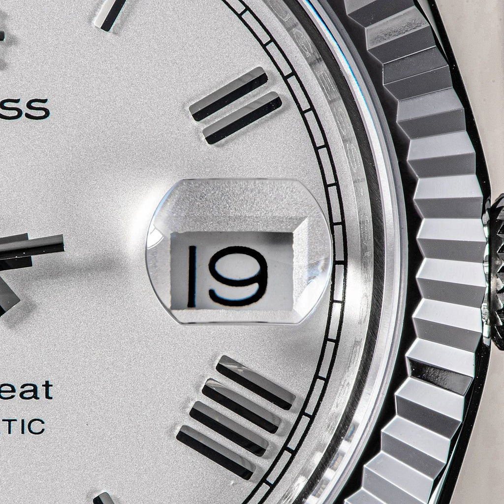 Sugess S433 white silver dial date window and fluted bezel macro, applied baton markers, close-up