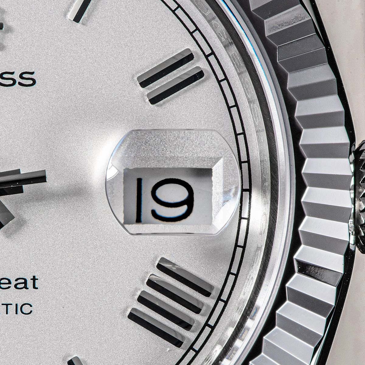 Sugess S433 white silver dial date window and fluted bezel macro, applied baton markers, close-up