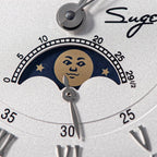 Sugess S437-05 dial moon phase display macro, gold moon face with stars on blue, retrograde date scale, close-up