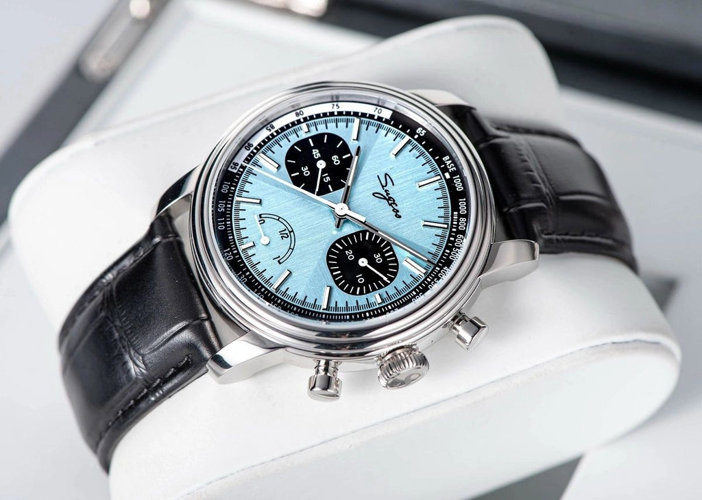Sugess S438 ice blue chronograph, black sub-dials, black leather strap, angled view on white stand