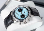 Sugess S438 ice blue chronograph, black sub-dials, black leather strap, angled view on white stand
