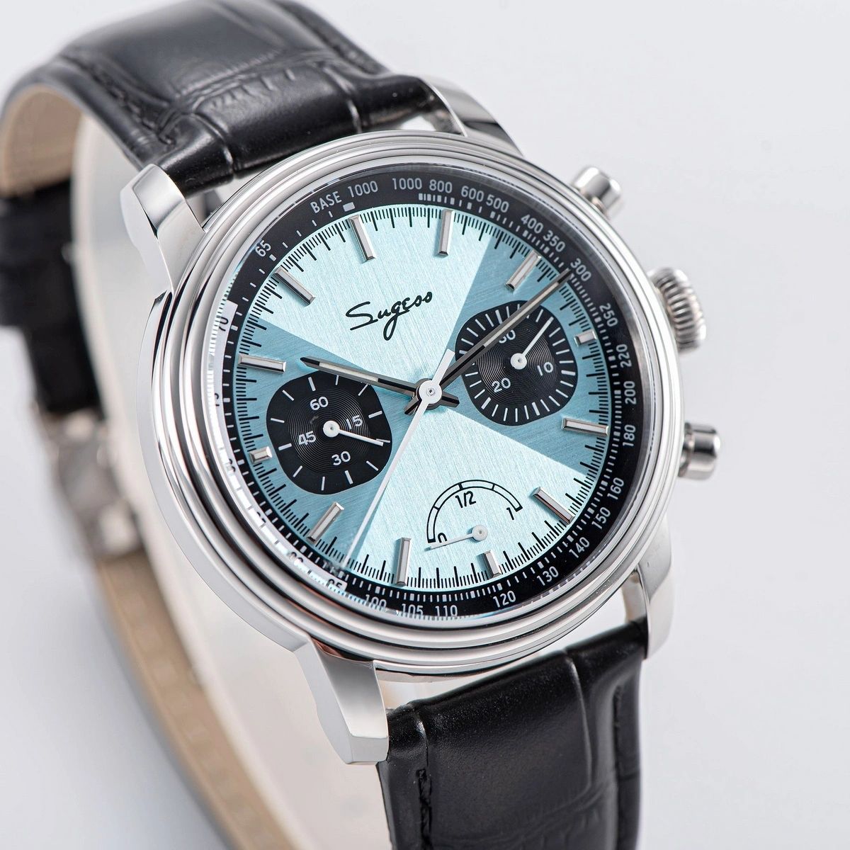 Sugess S438 ice blue chronograph, black sub-dials, black leather strap, dramatic angled view