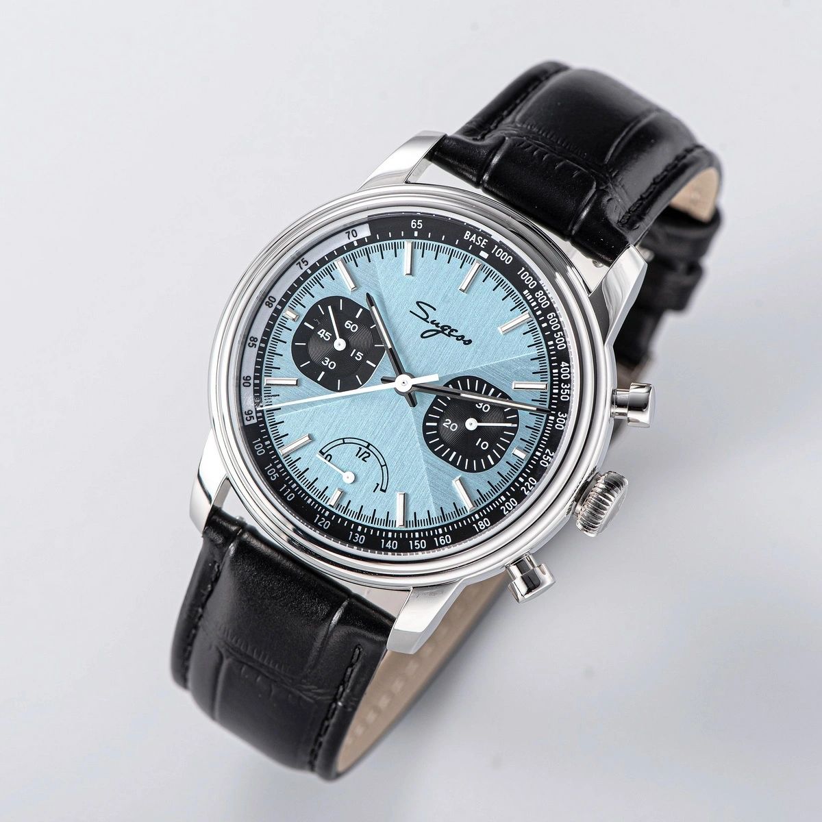 Sugess S438 ice blue chronograph, black sub-dials, black leather strap, three-quarter angled view