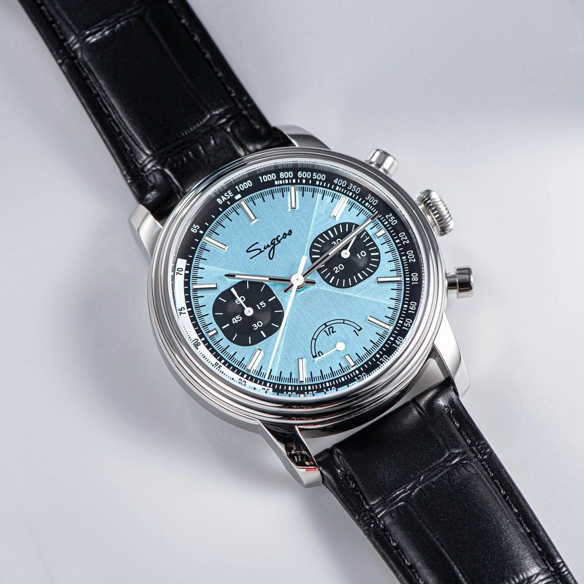 Sugess S438 hand-wind chronograph 41mm, ice blue dial, black sub-dials, brown perforated racing strap, front