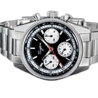 Sugess S442 black panda chronograph, white sub-dials, steel bracelet, three-quarter angled view on dark surface