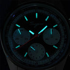 Sugess S442 black dial chronograph glowing blue-green lume in the dark, markers and hands, sub-dials, close-up