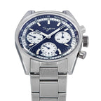 Sugess S442 blue panda chronograph, white sub-dials, steel bracelet, angled view resting on a blue box