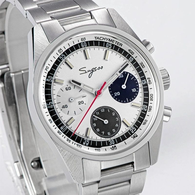 Sugess S442 silver panda chronograph, blue and black sub-dials, steel bracelet, three-quarter angled view on dark