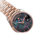 Sugess S449 black mother-of-pearl dial day-date, rose gold case, diamond markers, angled view on textured surface