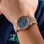 Sugess S449 black mother-of-pearl day-date on the wrist, rose gold president bracelet, worn with a navy shirt