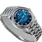 Sugess S449 blue dial day-date, fluted steel bezel, diamond markers, dramatic angled studio view on black