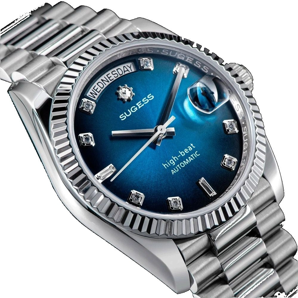 Sugess S449 blue sunburst dial macro, diamond hour markers, day and date windows, fluted steel bezel, close-up