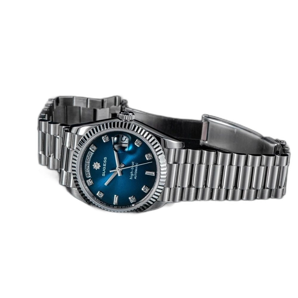 Sugess S449 blue dial day-date side profile, fluted steel bezel, president bracelet open, on dark surface