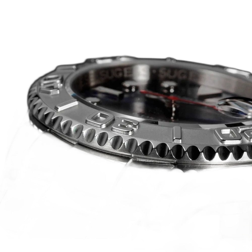 Sugess S450 dive watch coin-edge bezel and steel case macro, engraved dive scale numerals, close-up on black