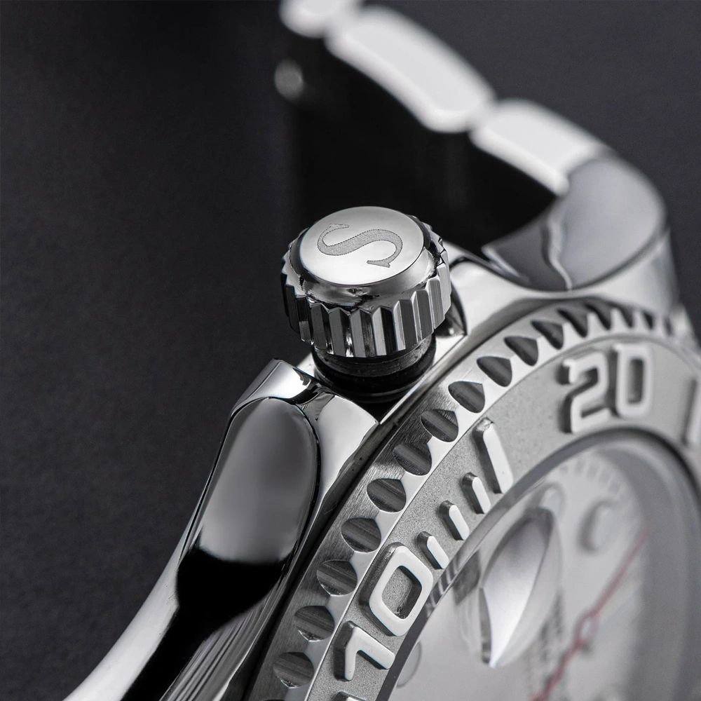 Sugess S450 dive watch S-engraved screw-down crown and case flank macro, coin-edge bezel, close-up on black
