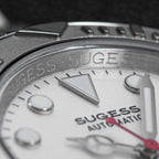 Sugess S450 silver-white dial macro, applied markers, triangle lume pip, Sugess Automatic text, red seconds, close-up