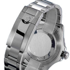 Sugess S450 grey dial dive watch bezel and lug macro, coin-edge bezel and polished case flank, close-up on black
